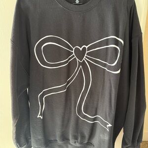 Elegant Black Sweater with Heart Bow Design